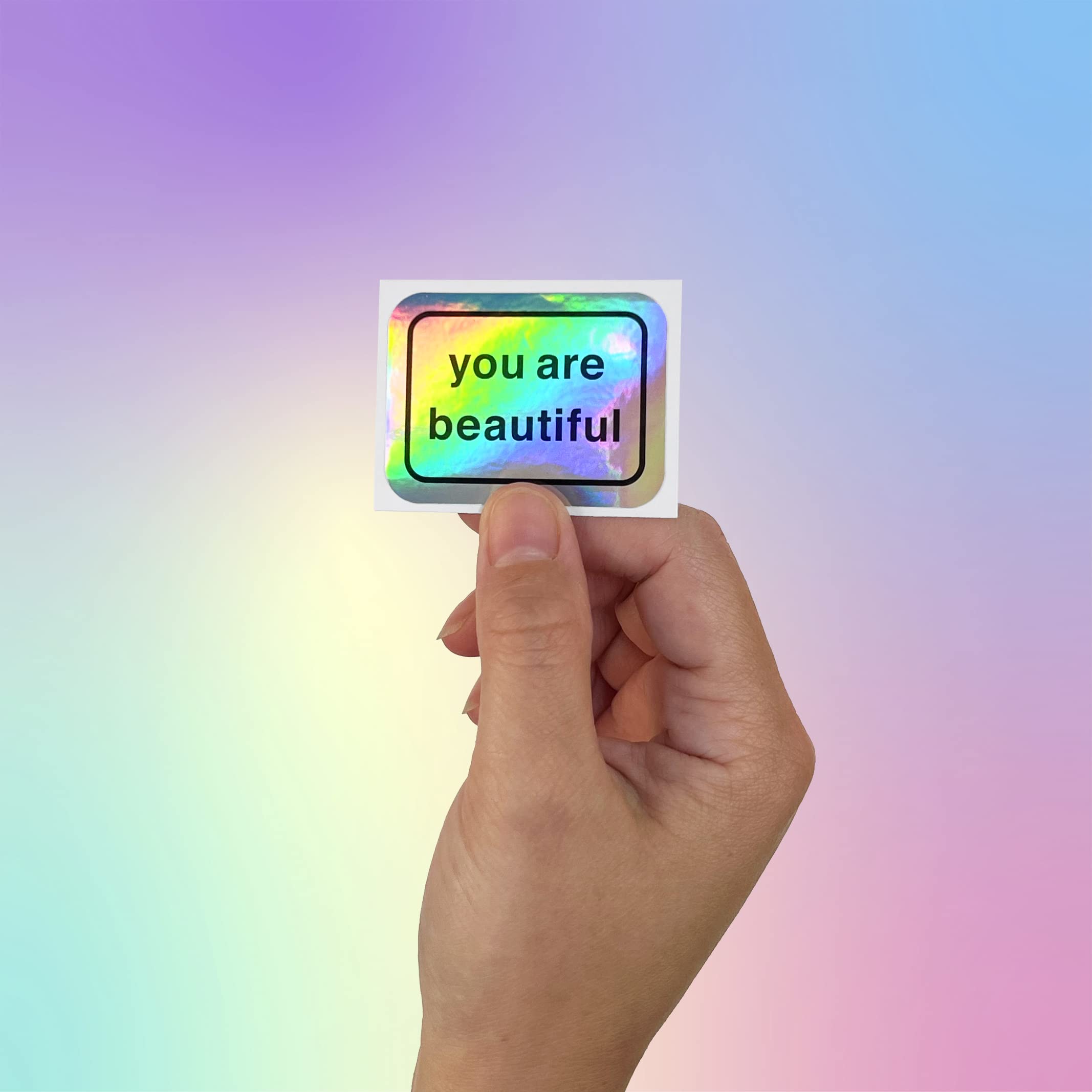 Close-up of You Are Beautiful holographic stickers catching light for inspiration