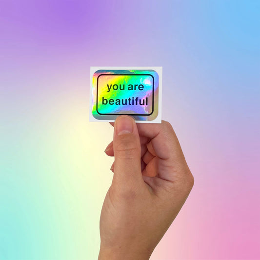Close-up of You Are Beautiful holographic stickers catching light for inspiration