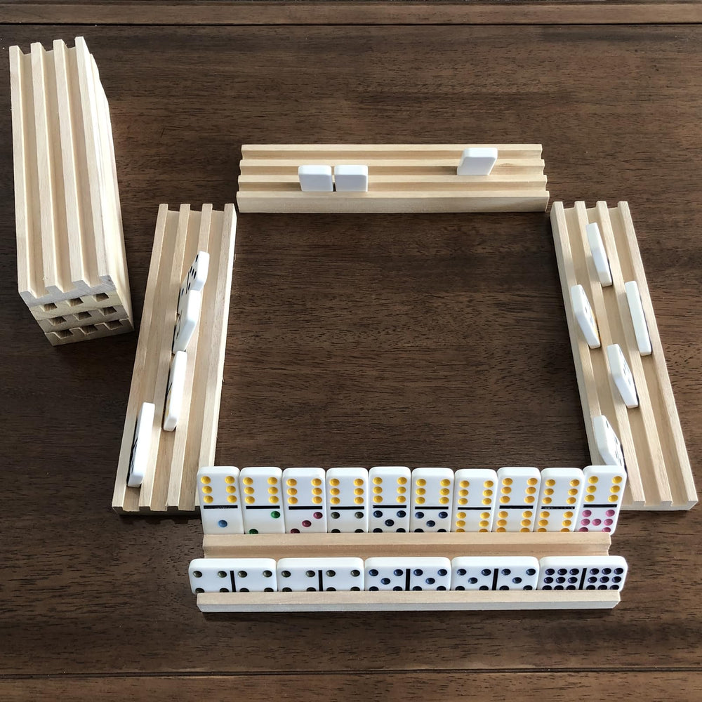 Eight-rack setup ready for family game night and organized domino collection.