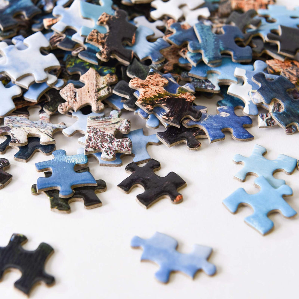 Close-up of Yundu Moraine Lake puzzle pieces highlighting thick, durable edges.