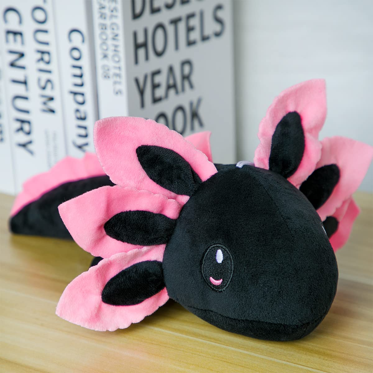 ZEKLZD axolotl plush in blue and black decorates any room.