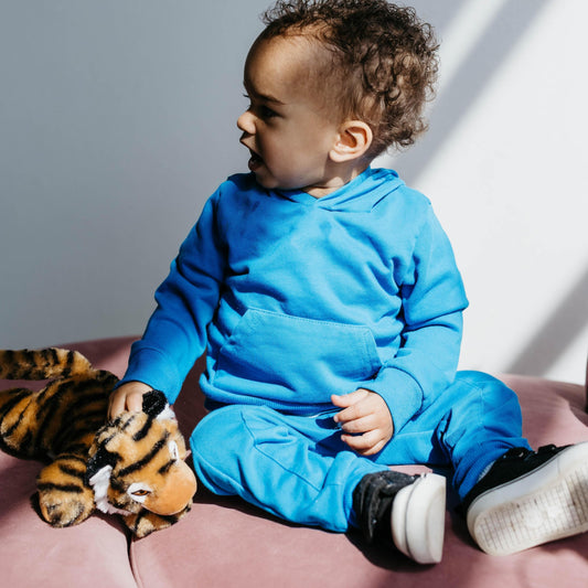 Zoologee tiger prowling presence invites curious discovery of predators in screen-free play.