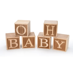 ZouYee Oh Baby wooden blocks with front letters on a table for photos.